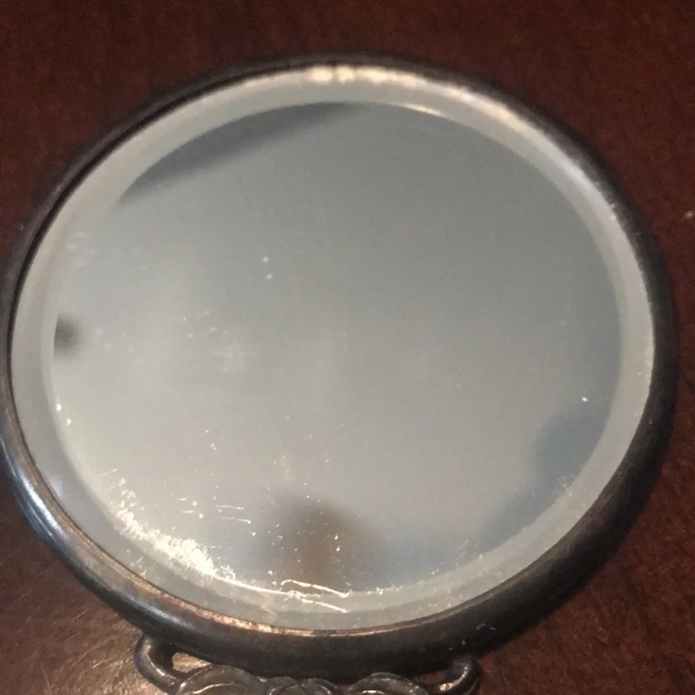 Antique silver small mirror and comb set